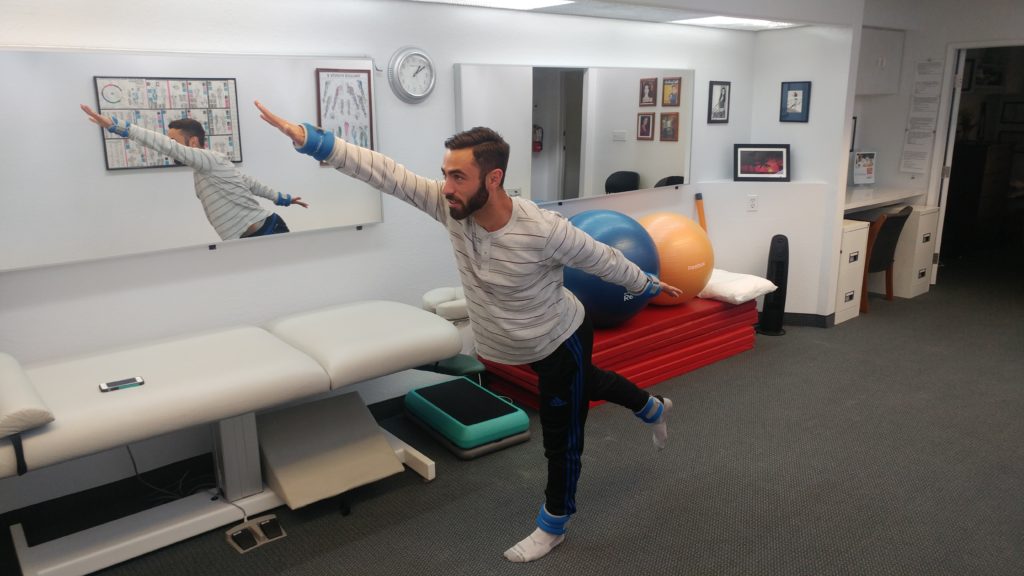 Soccer player showing active therapy exercises Tustin Chiropractic clinic