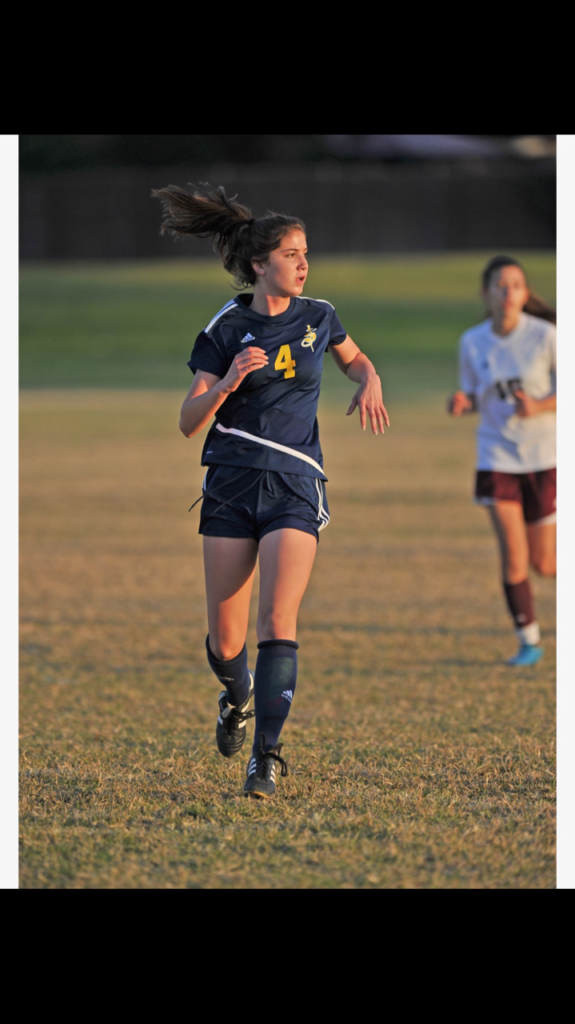 Soccer player running in game