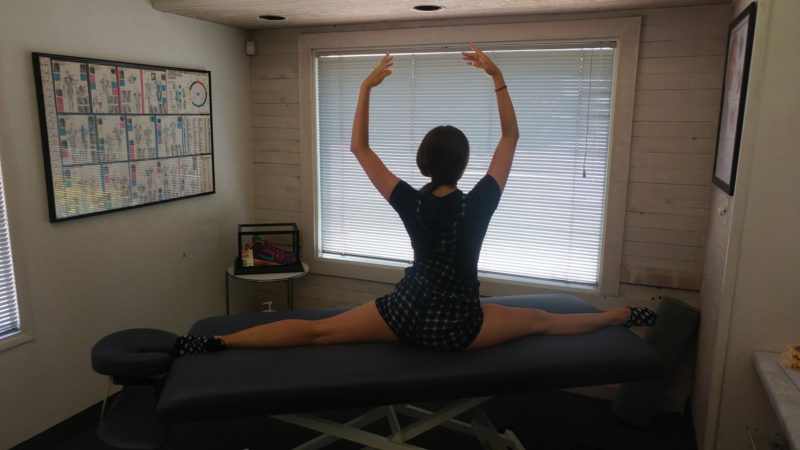 Ballet dancer stretches at Tustin Chiropractic office