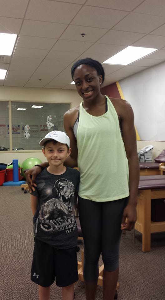 Professional Basketball Star Nneka Ogwumike with young fan